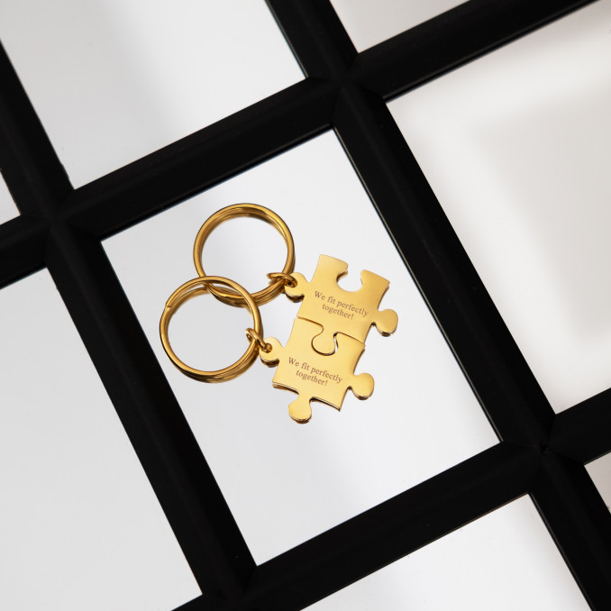 Graveerbare gouden puzzelstuk sleutelhangers met tekst