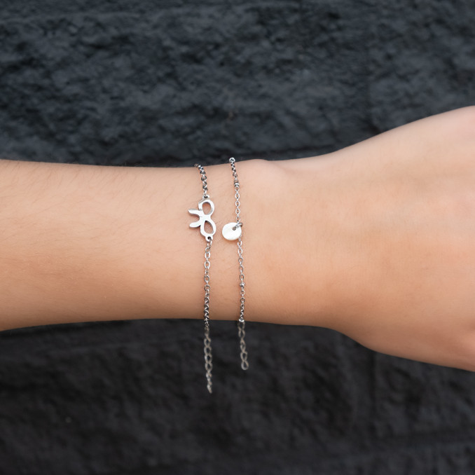 Minimalistische armband met schelpje en stainless steel armbandje