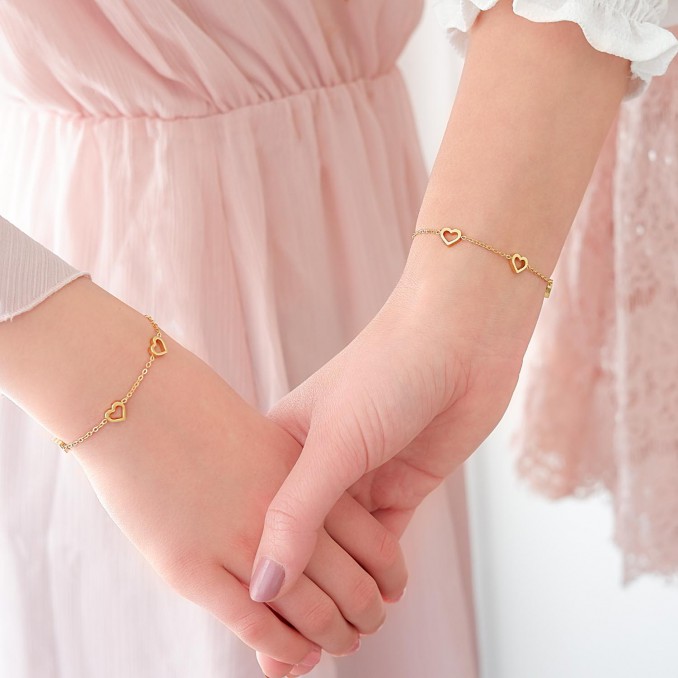 Gouden moeder en dochter armband met hartjes om te delen