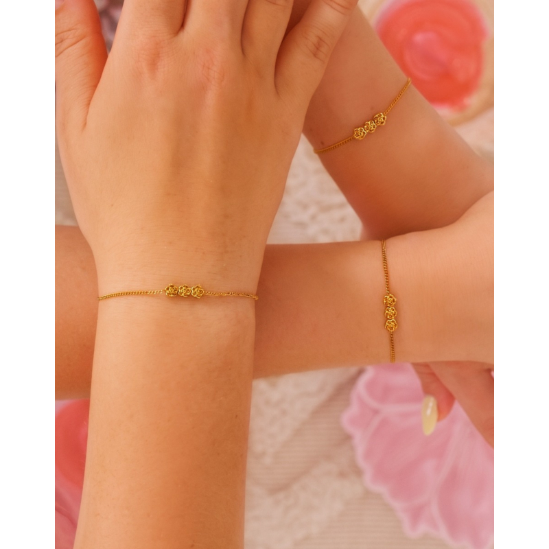 Kids armband triple flower goudkleurig