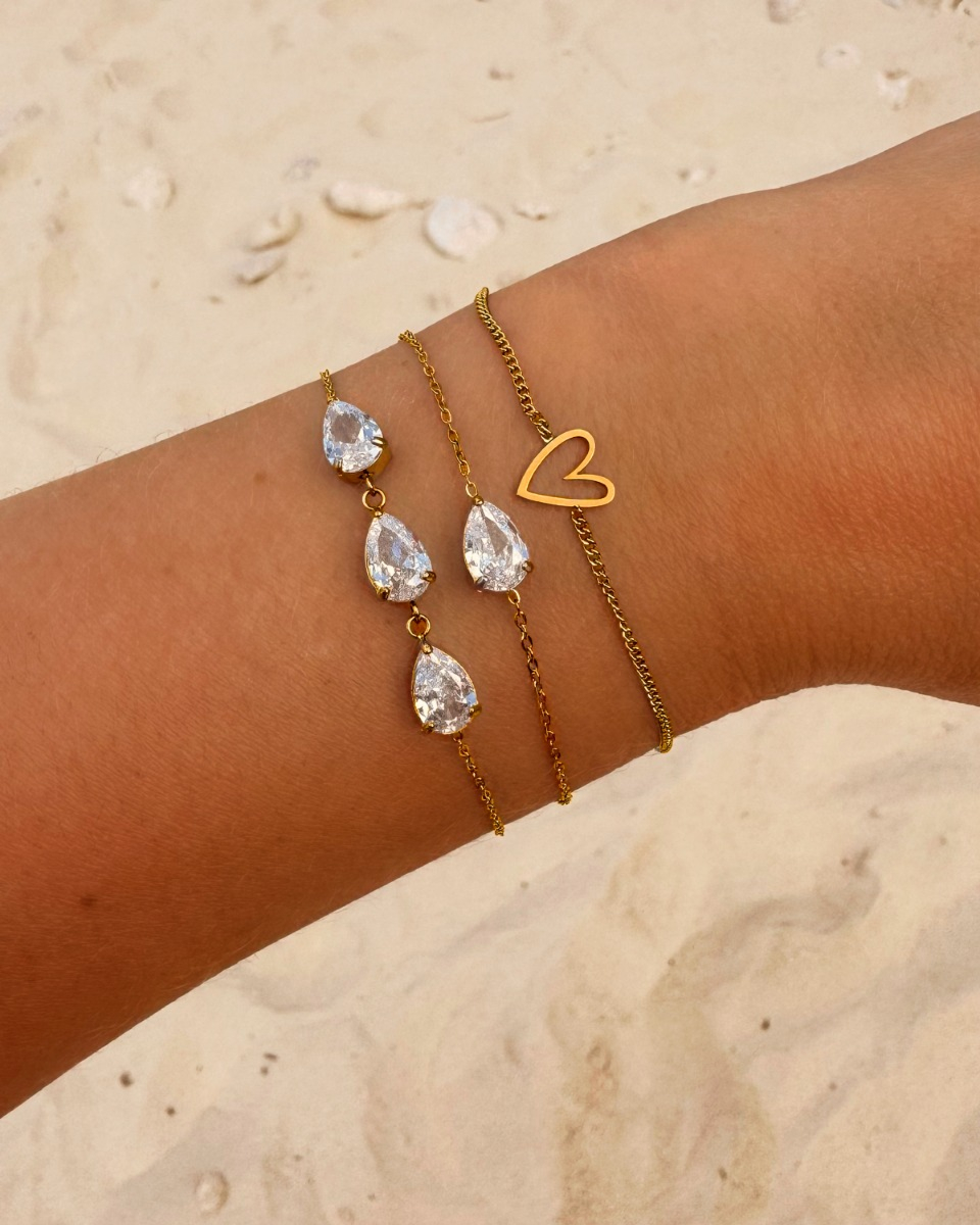 Gouden armparty hartje en steentjes
