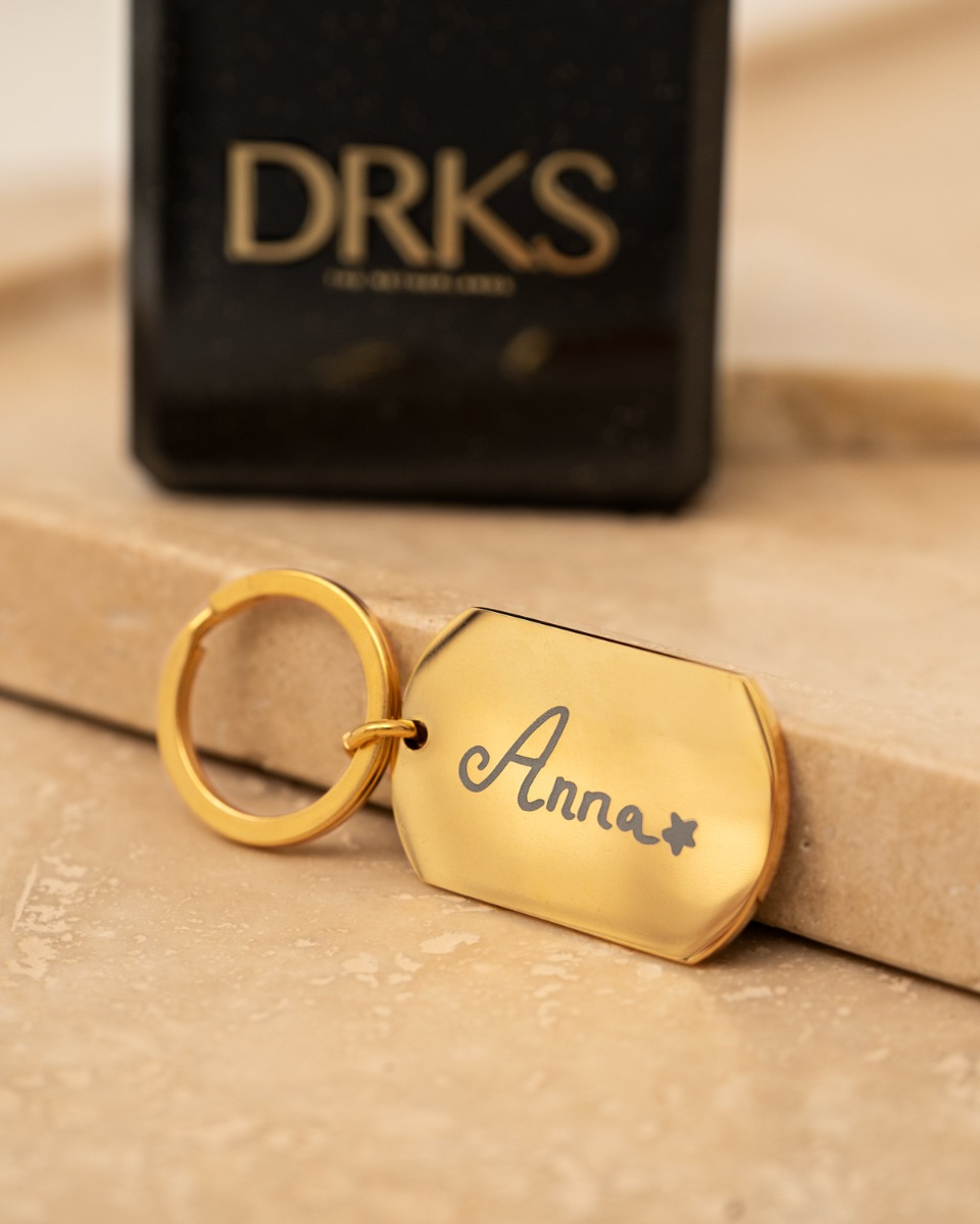 Gouden sleutelhanger met naam tekening