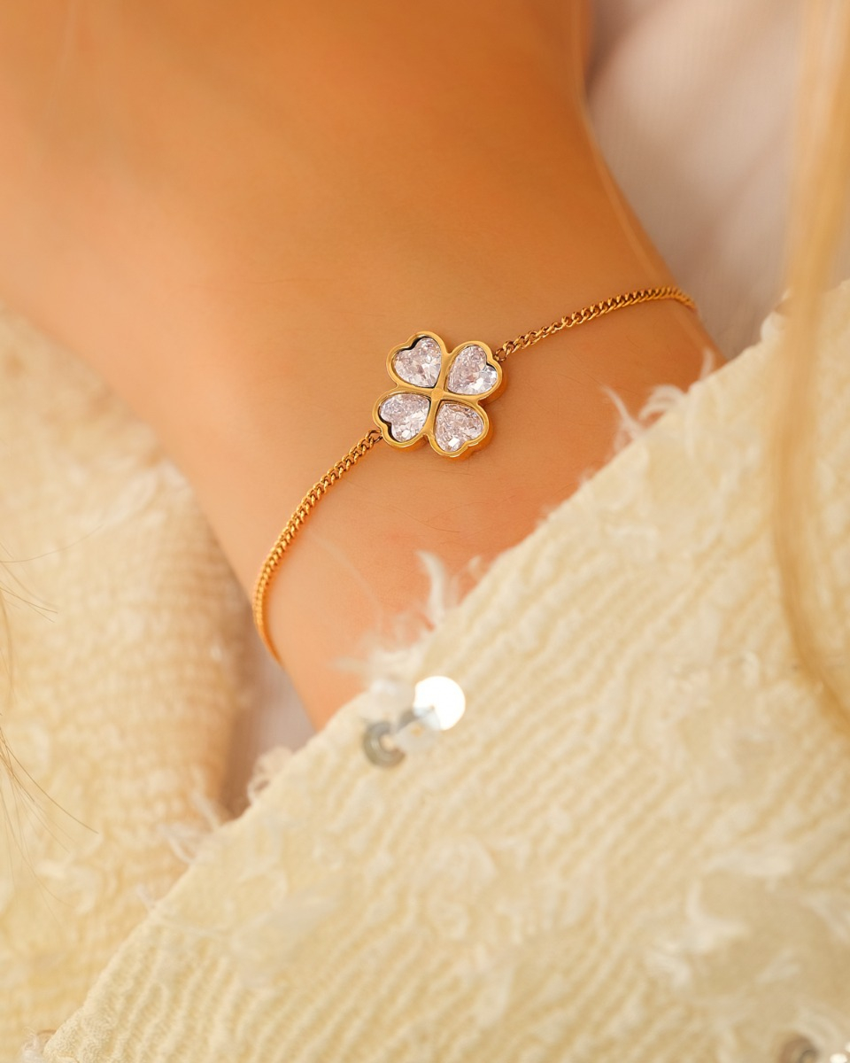 gouden klavertjes armband met steentjes