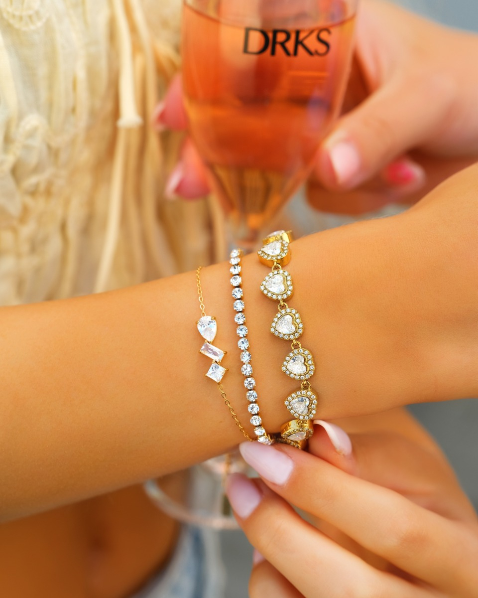 Gouden armparty met steentjes