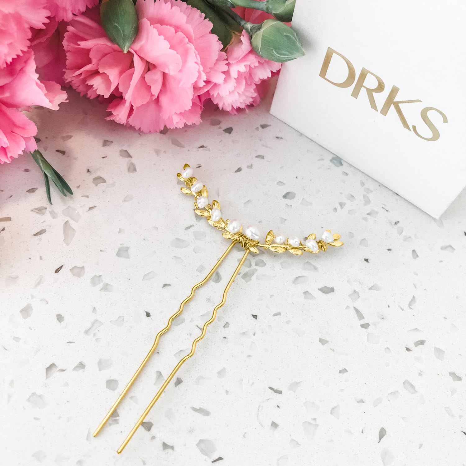 Mooie gouden haarpin met pareltjes voor een complete look
