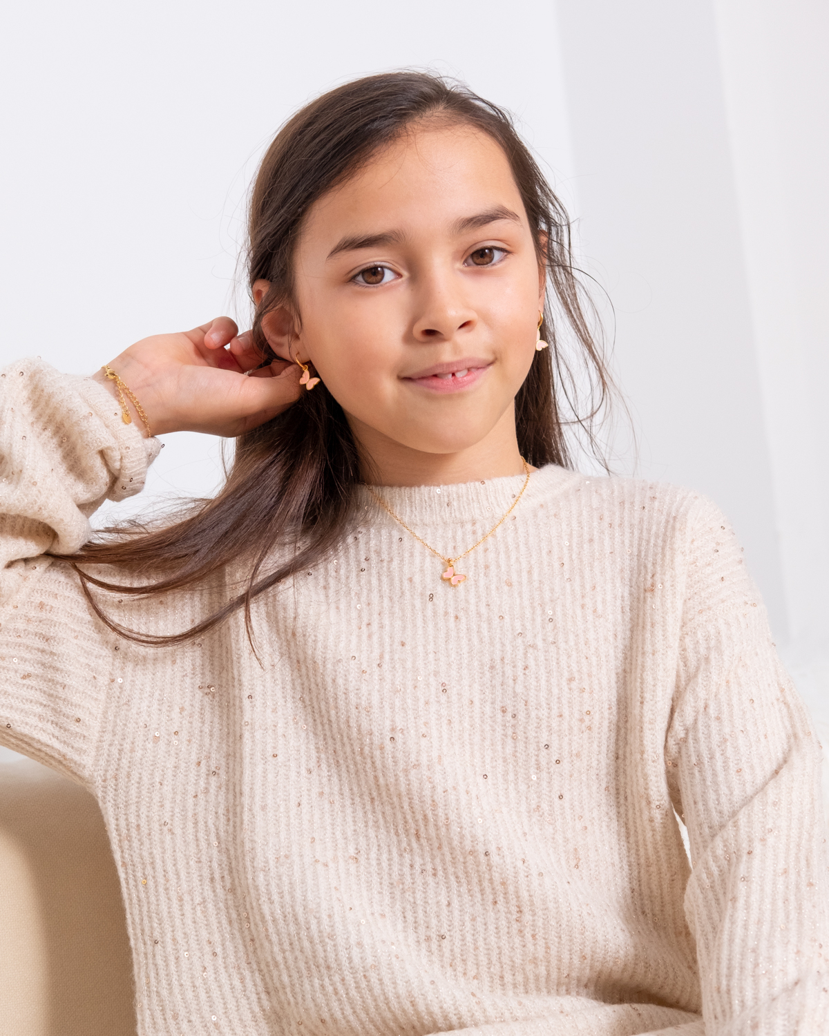 Sieraden set goudkleurig met roze vlindertje