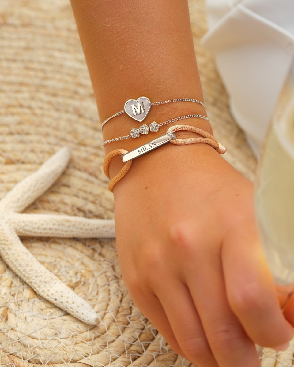 Zilveren armparty met initialen