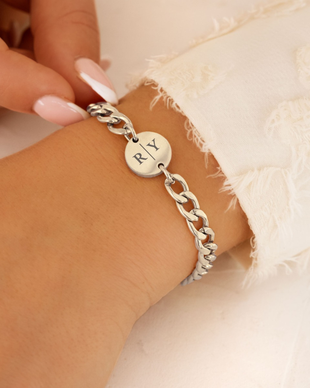 Zilveren schakelarmband met muntje