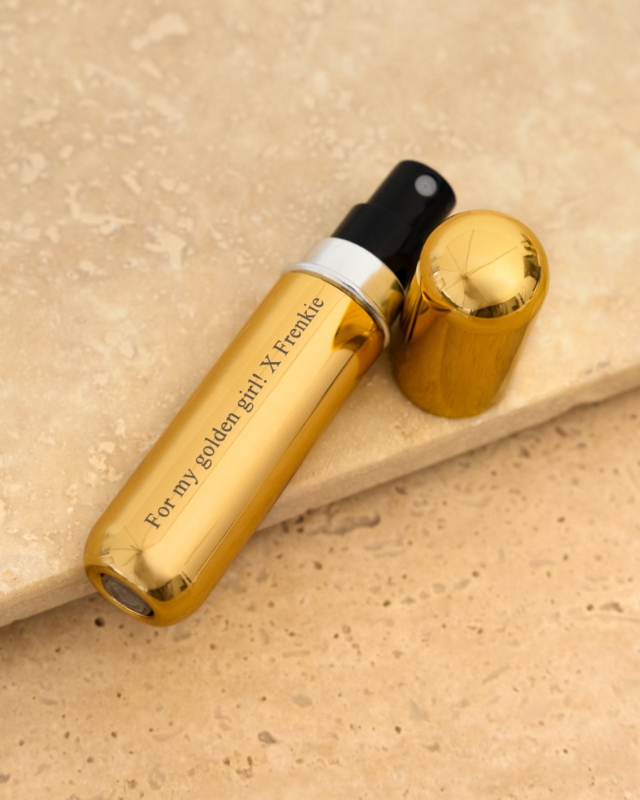 Gouden parfumverstuiver met tekst