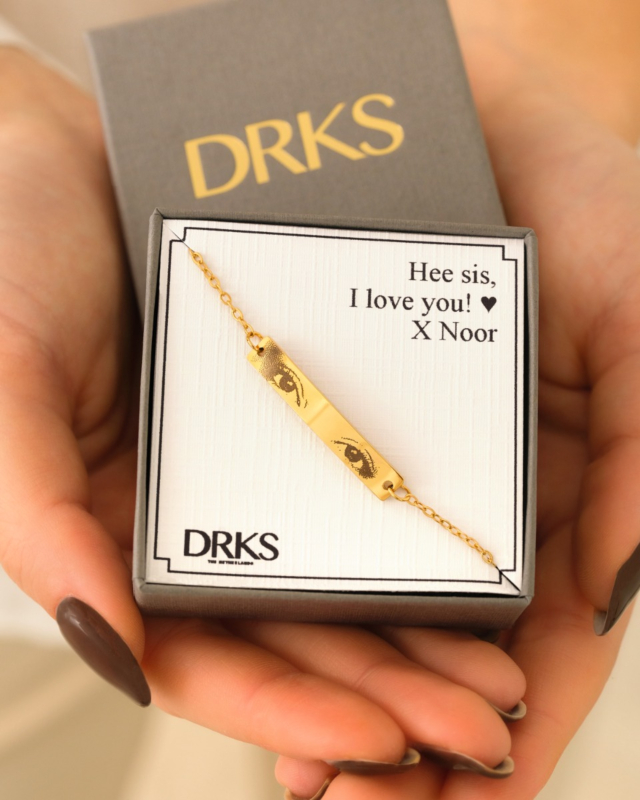 Gouden bar armband met ogen