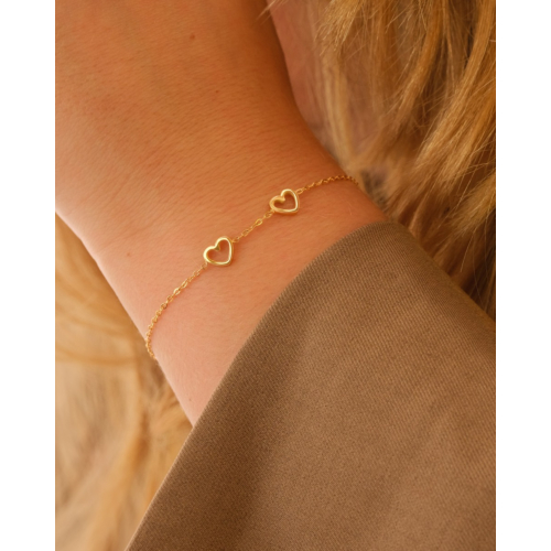Armband met 2 hartjes goudkleurig