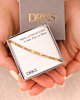 Schakelarmband met plaatje in sieradendoosje goud