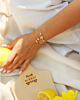 Gouden armbanden met steentjes mix