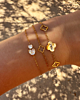 Gouden armparty met hartjes en klavers