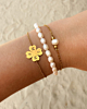 Gouden armparty met parels