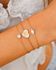 Gouden armparty met steentjes