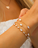 Gouden armparty met steentjes