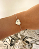 Hartjes armband met where we met om pols