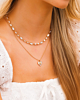 Gouden necklaceparty met steentjes