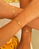gouden armbandjes met kruisjes