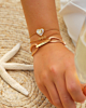 Gouden armparty met initialen