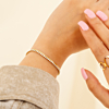 Gouden armparty met tennis armbanden