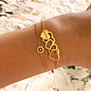 Gouden armparty met hartjes en bloem