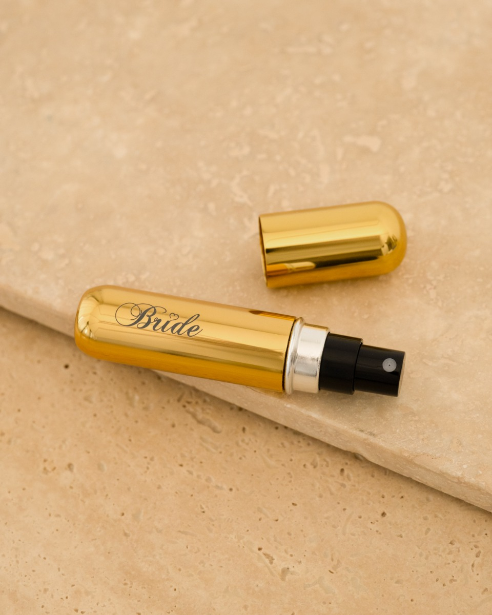 Gouden parfumverstuiver met bruid