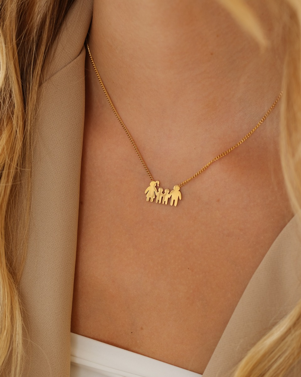 Gouden ketting met man, vrouw en twee kinderen
