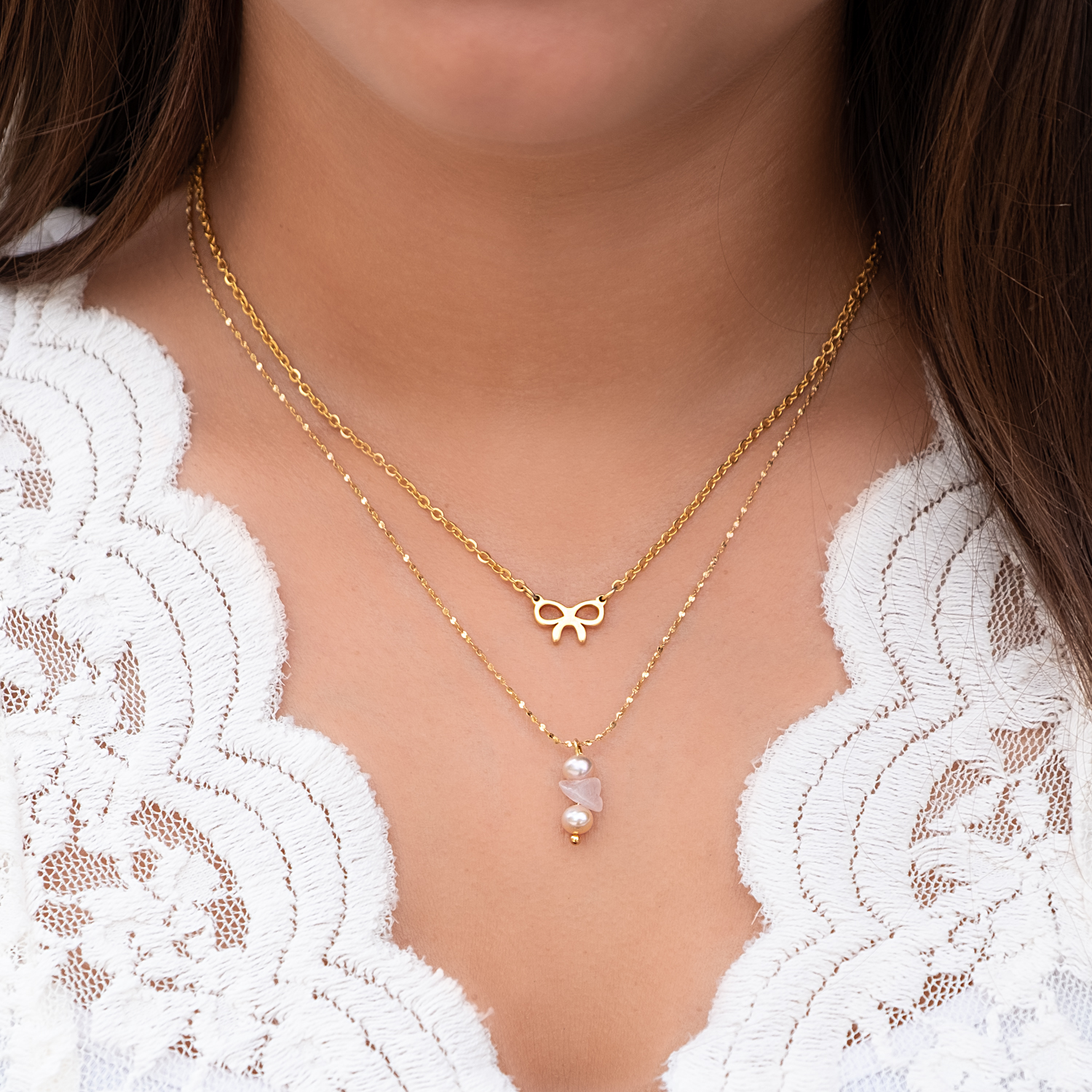 gouden kettingen met pareltjes en rozenkwarts