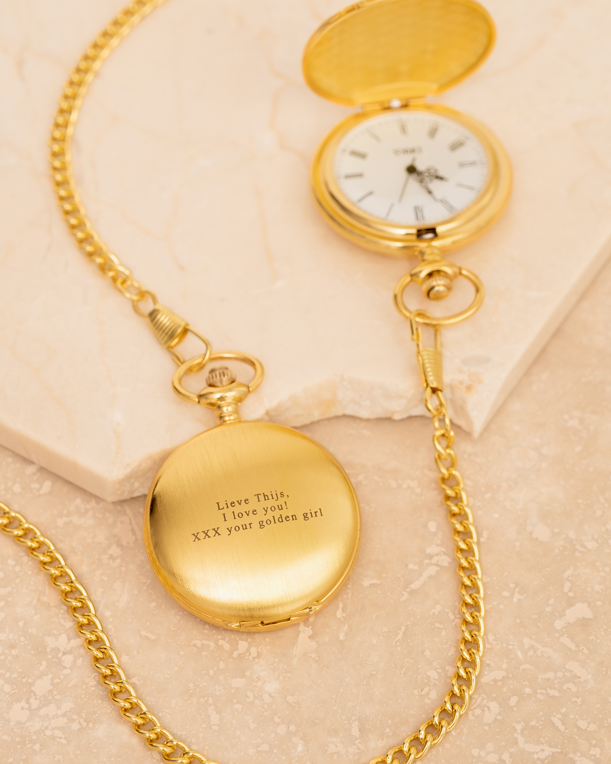 pocket watch goud marmer ondergrond